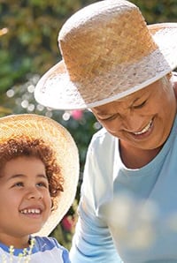 Grandchild helping their grandmother