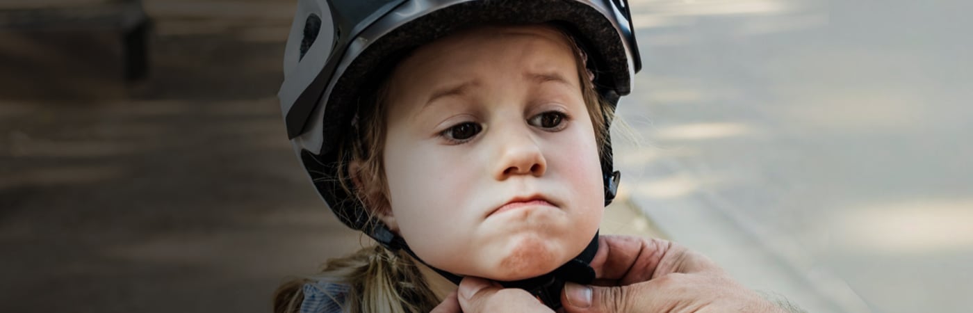 Young girl in cycling helmet