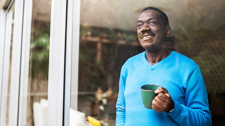 Man looking out of a window