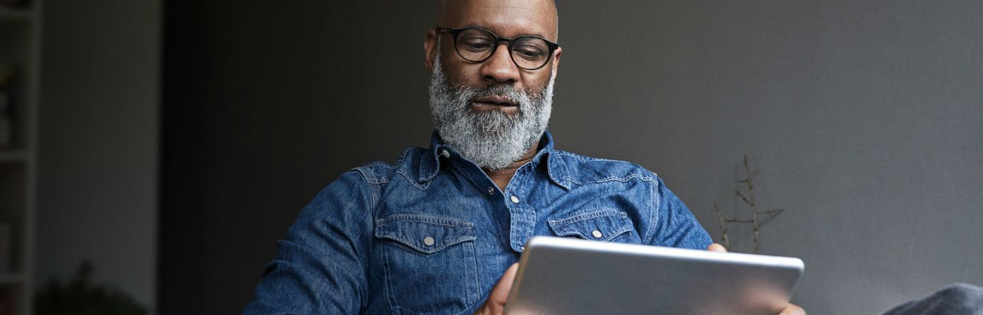 A man working on a tablet.