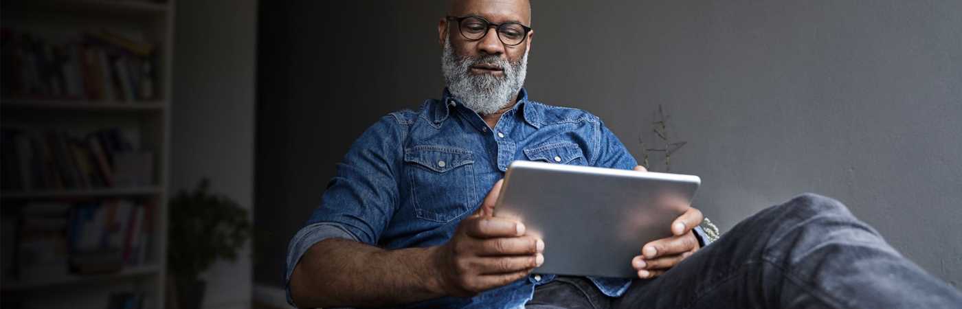 Man looking at tablet