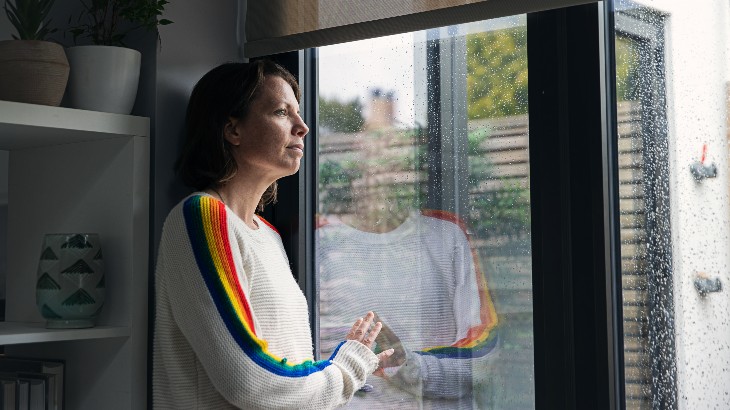 Woman looking out of window