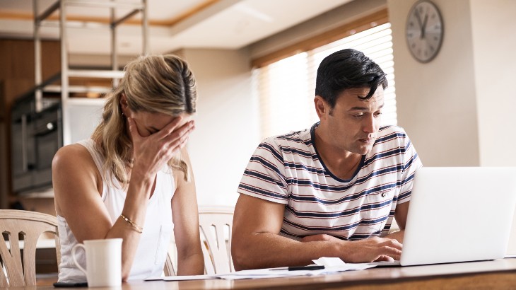 couple at desk doing paperwork