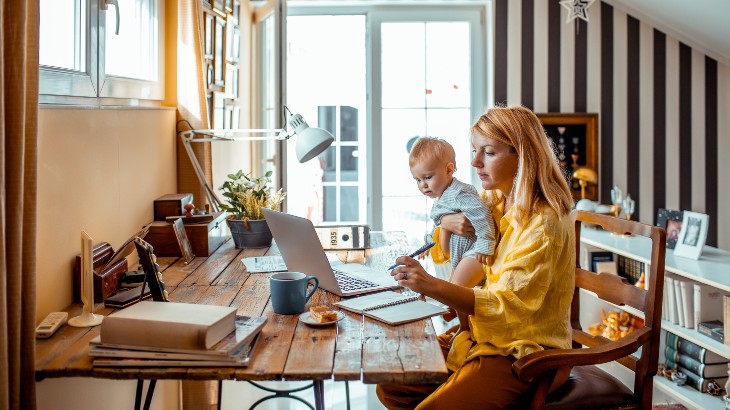 mum and baby at desk