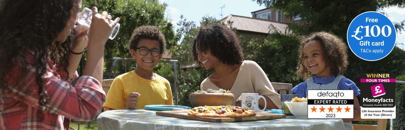 Life Insurance with £100 free gift card. Family sitting around the garden table
