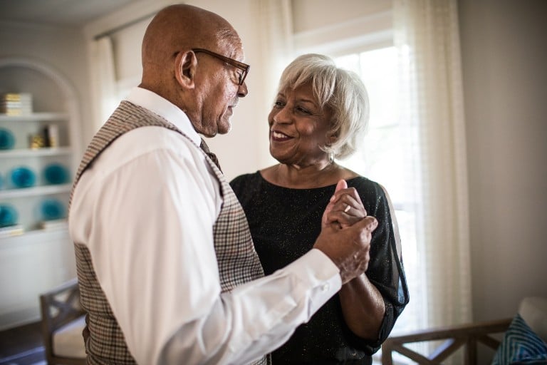 senior couple embracing with hands