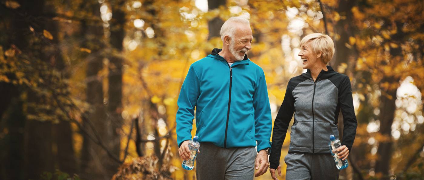 Mature active couple walking