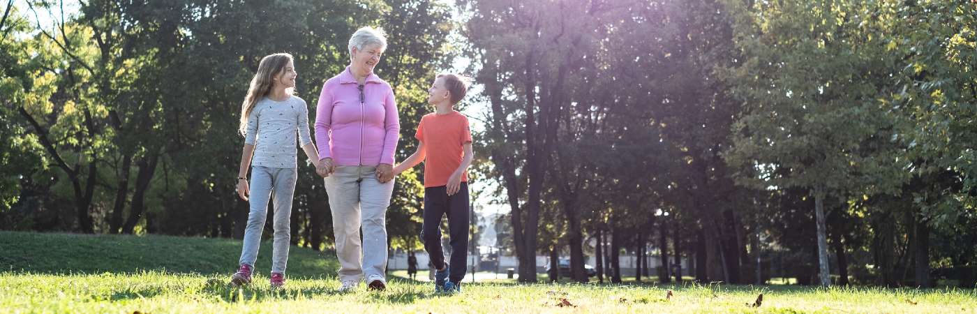 Grandmother walking with grandchildren