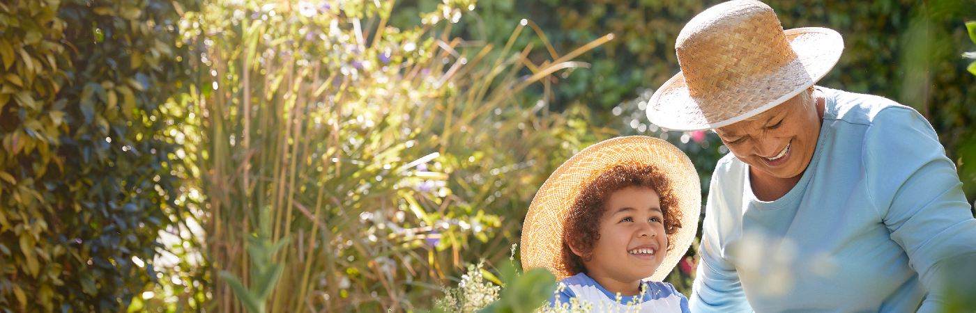 Grandmother with grandson in the garden