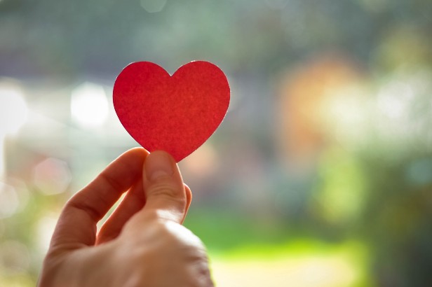 Hand holding a heart shape
