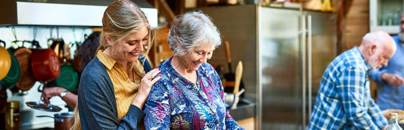 Senior mother and daughter cooking together