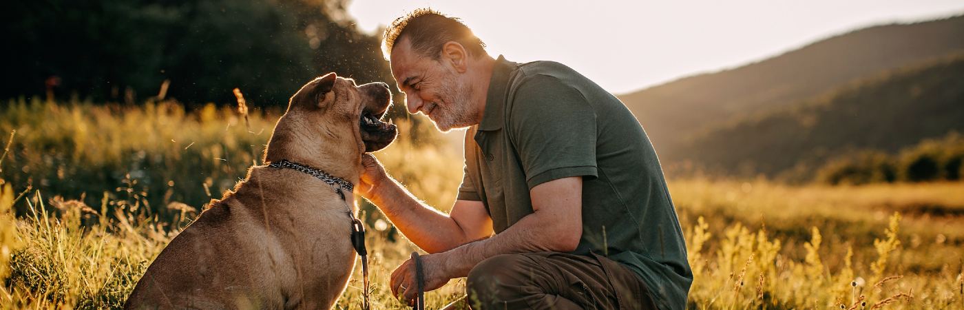 senior man out with his dog
