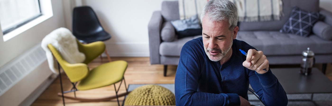 Senior man working through paperwork