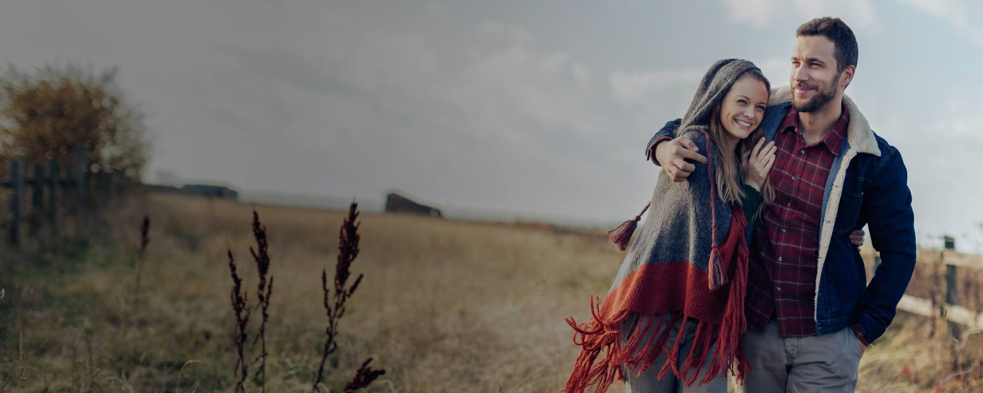 Couple walking in field
