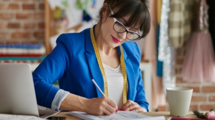 Lady designer making notes
