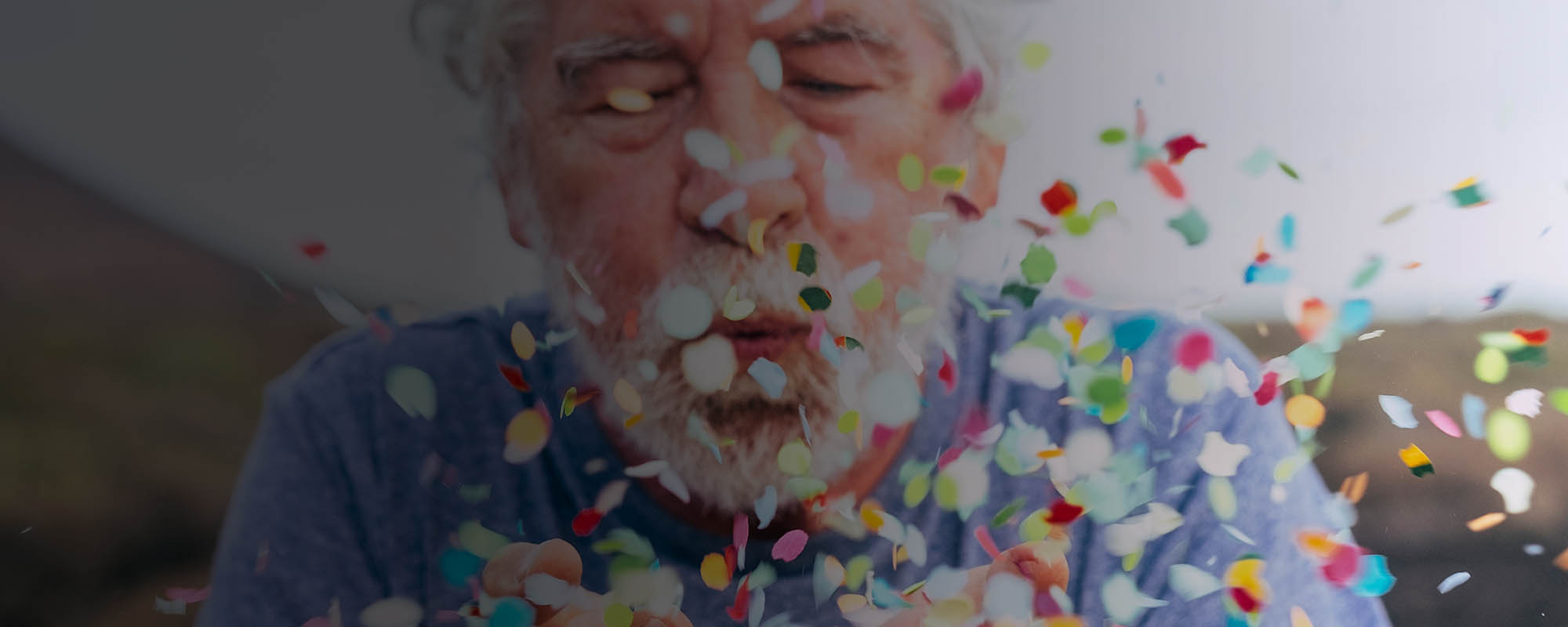 Man blowing confetti