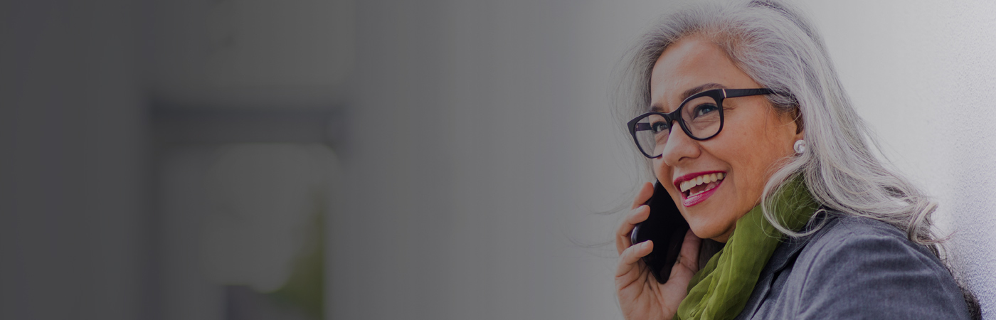 Smiling older woman talking on a mobile phone