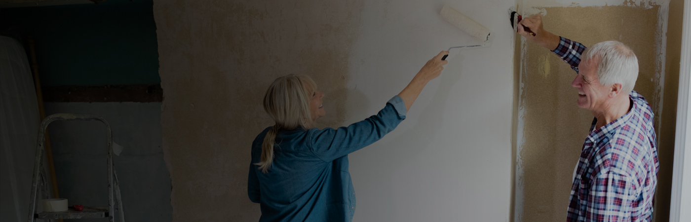 Man and woman decorating house