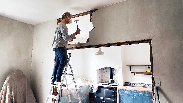 Man-removing-interior-wall-730x410.jpg