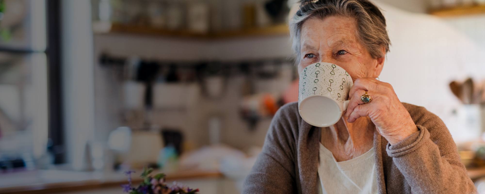 Lady drinking a hot drink