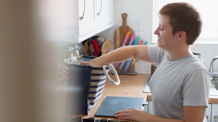 lady in kitchen with shopping.jpg