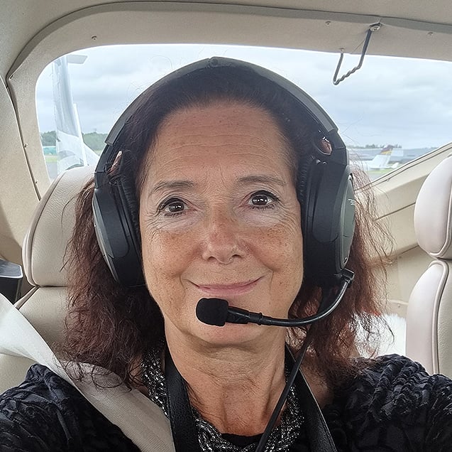 Cheryl in an aeroplane cockpit