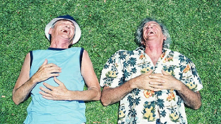 Couple laying on the grass